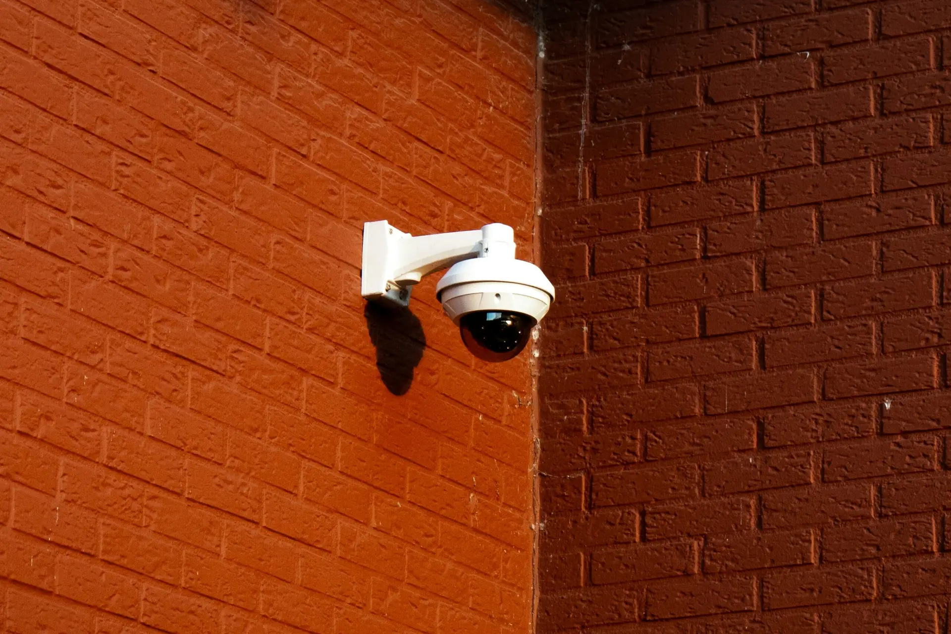 CCTV camera installed on brick wall by A-OK Security